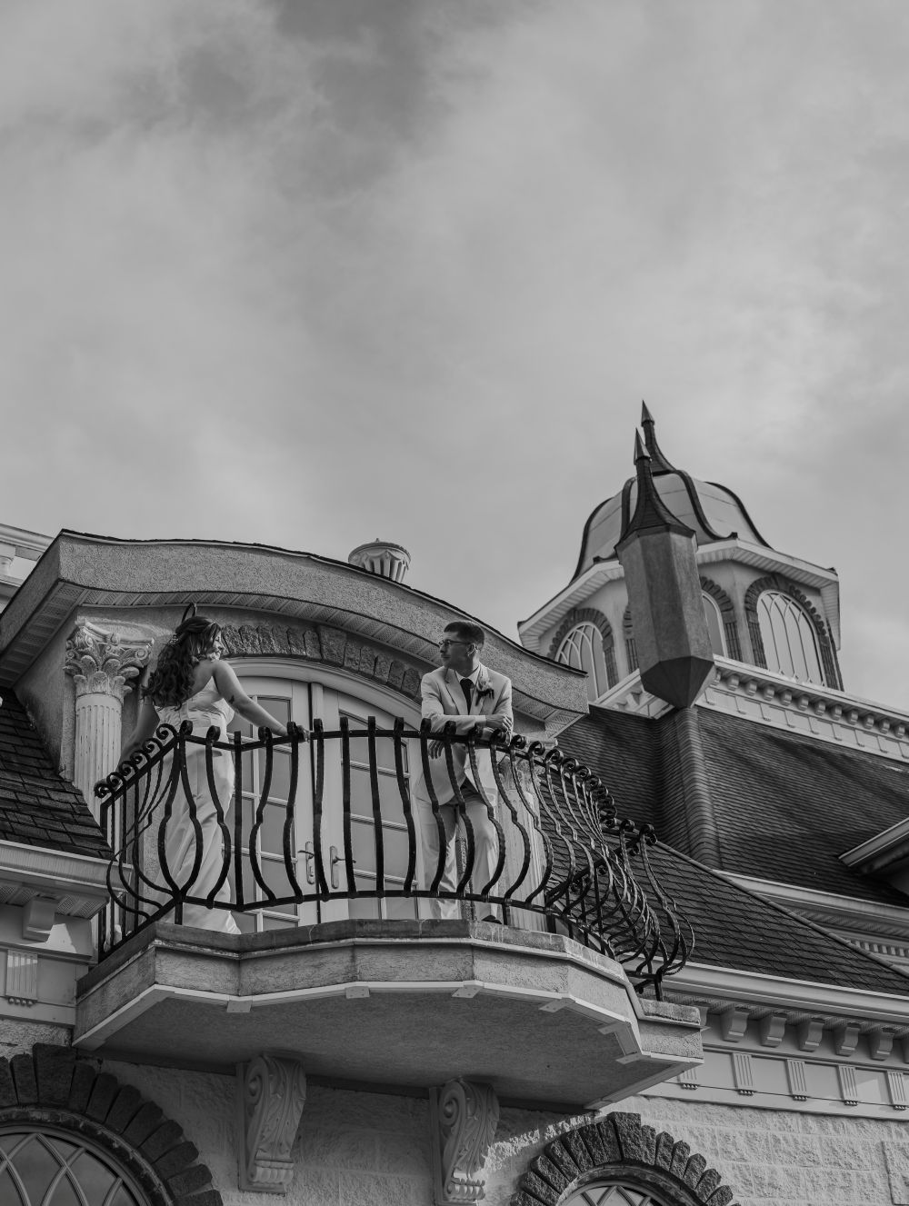 Couple looking at each other on the estate balcony