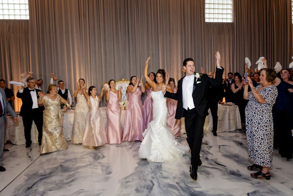 Couple's grand entrance in the ballroom