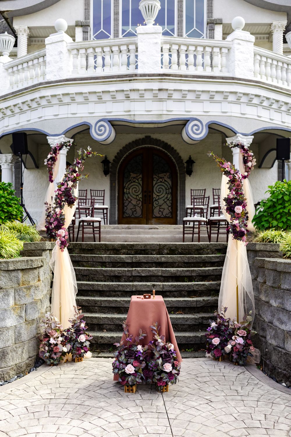 Beautiful floral arch on the terrace steps