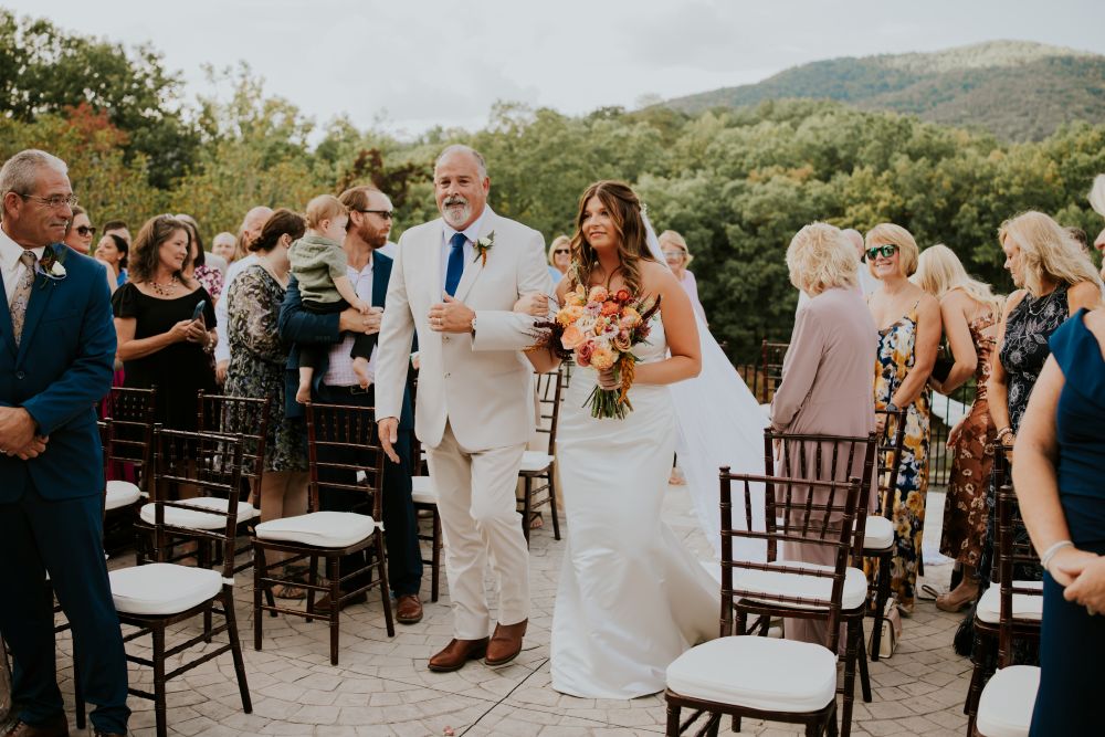 Bride walking down the terrace aisle